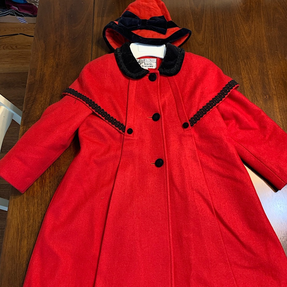 Beautiful red wool/poly girls coat with black velveteen trim. Hat included.